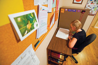 Madison Sutliff, 11, studies at her family's office in Gallup Wednesday. Sutliff and her brother are home-schooled by their parents. © 2011 Gallup Independent / Brian Leddy